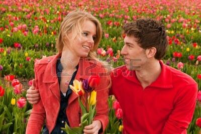 13473514-happy-young-couple-in-dutch-flo